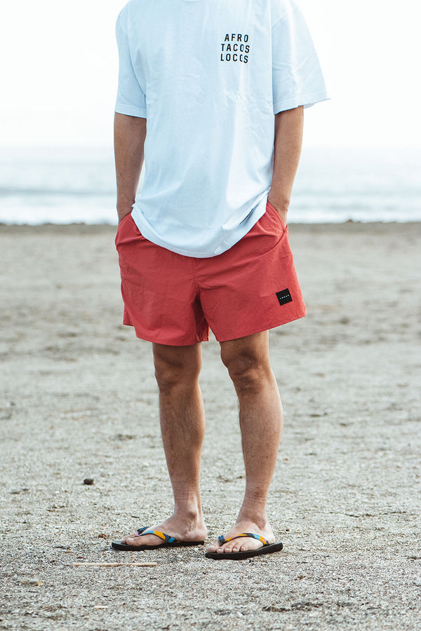 "ONE MILE IN THE BOROUGH" NYLON SHORTS - CORAL